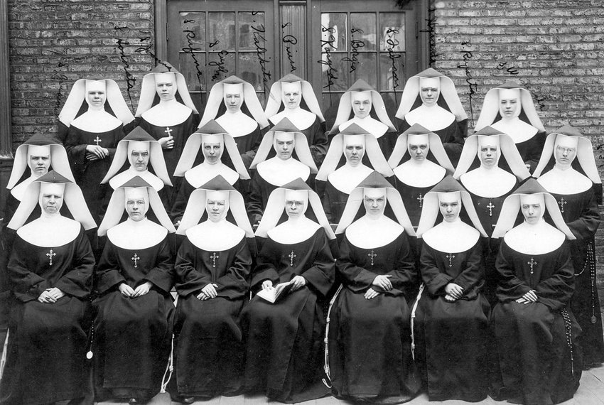 Nuns pose outside St. Mary of Perpetual Help School in Chicago in 1922. The image appears in a documentary titled "Women & Spirit: Catholic Sisters in America" and airing on NBC as part of its "Horizons of the Spirit" series. The film, which can be broadcast by local affiliates until March 15, 2014, chronicles the 300-year contribution of U.S. women religious. (CNS photo/courtesy Leadership Conference of Women Religious) (Oct. 8, 2013) See FILM-SISTERS Oct. 8, 2013.