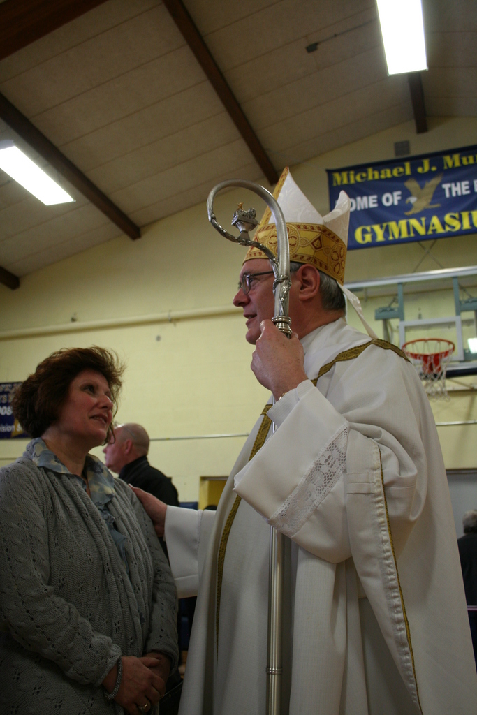 A TEMPORARY HOME: Sacred Heart parishioner Margaret?Balasco, of Coventry speaks Bishop Thomas J. Tobin after Sunday’s Mass at St. Joseph Church. Balasco said that she has felt welcomed by the St.?Joseph community, but is eager to return to her parish.