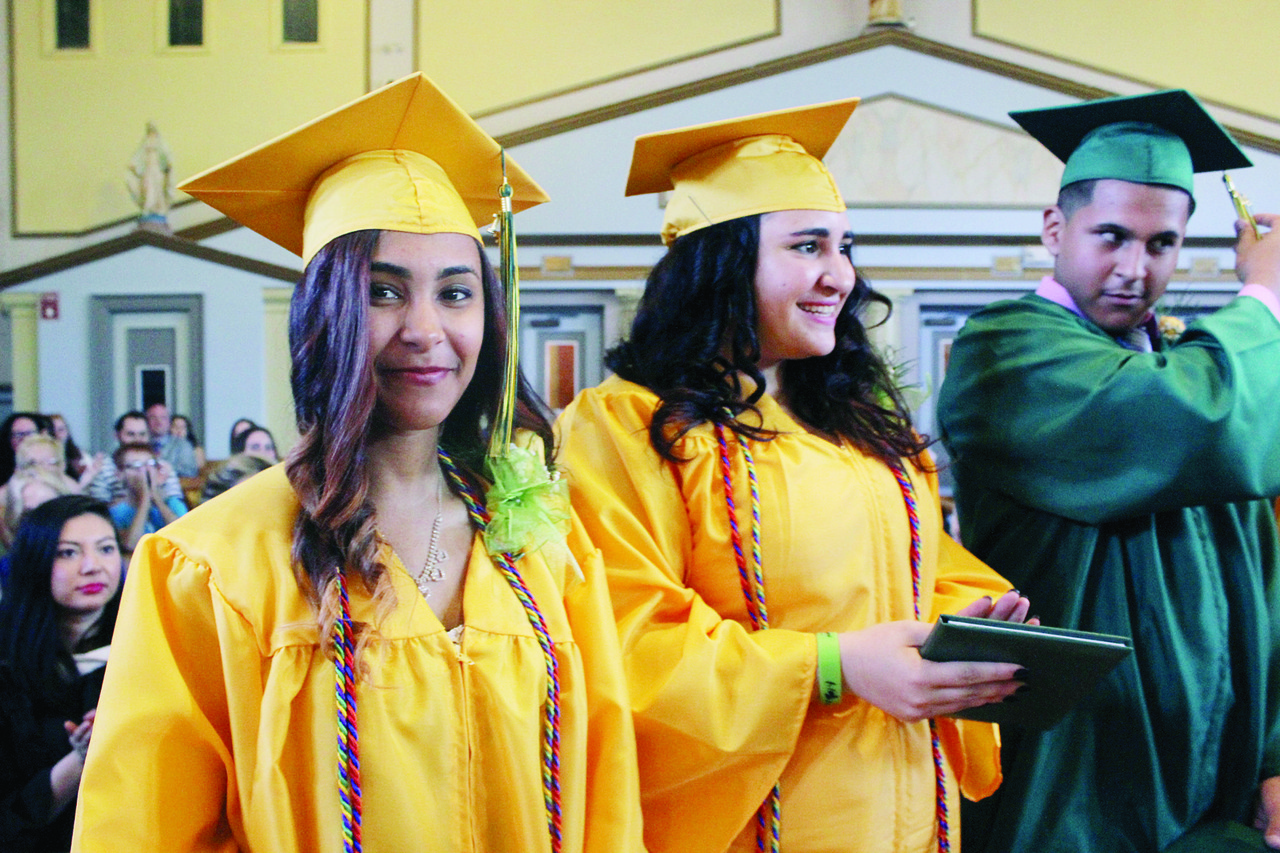 GLAD GRADS: Nathalie Batista, 19, left, along with her classmates, Luzelenia Morales and David Pinto, are proud of their accomplishments. "I?m always going to look back and say I was part of the first graduating class," Batista said.