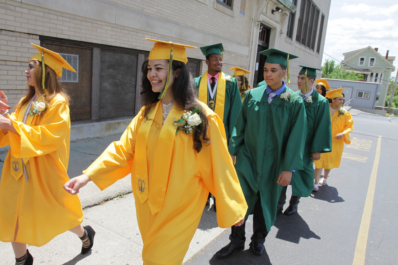 GRATEFUL GRADS: Class Valedictorian Alesen Jajou, left, and Bethany Marie Boucher lead the class into their commencement ceremony, which was held in St. Patrick Church, part of their school building.