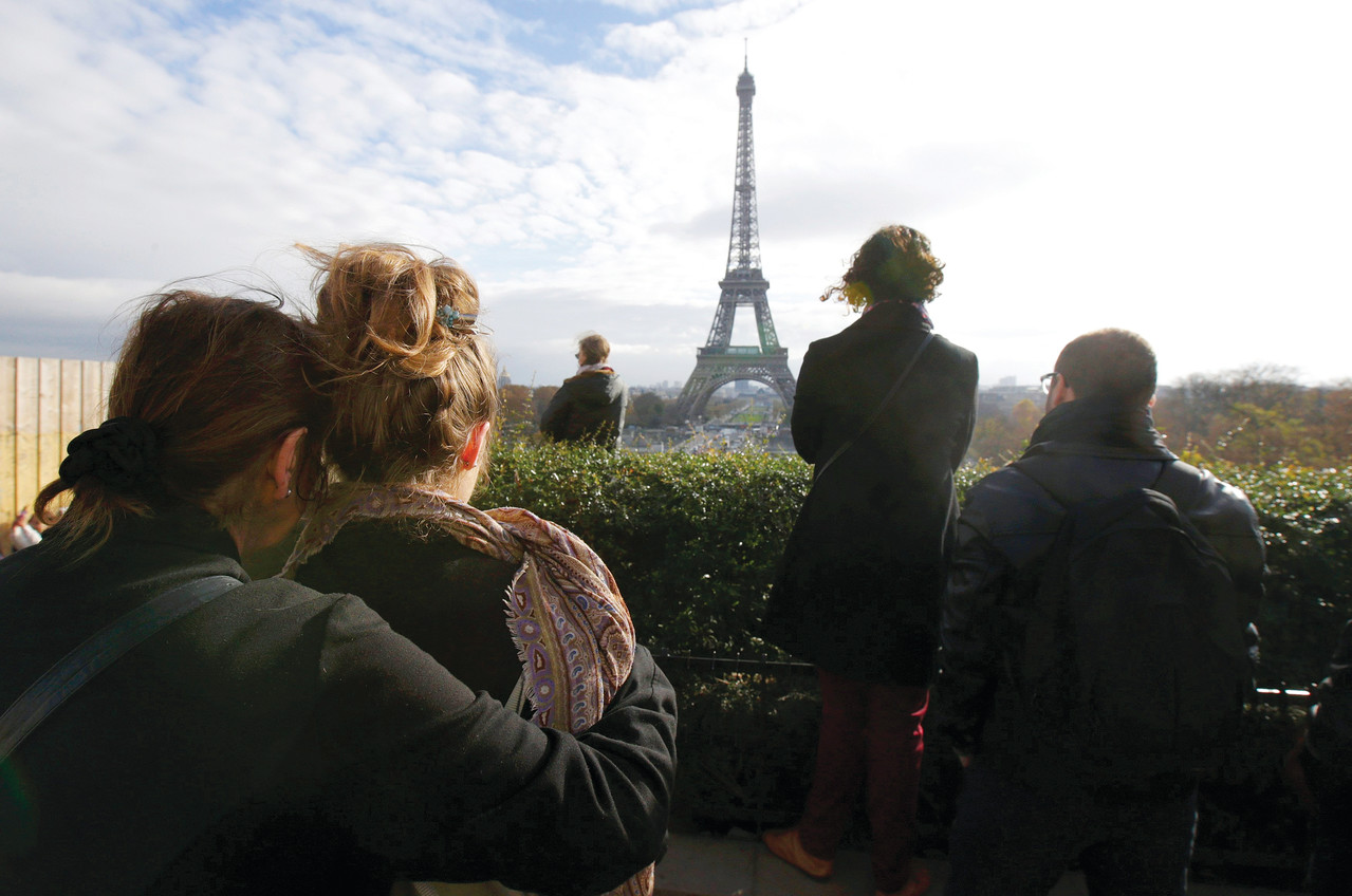 People observe a minute of silence at the Trocadero in Paris  Nov. 16.