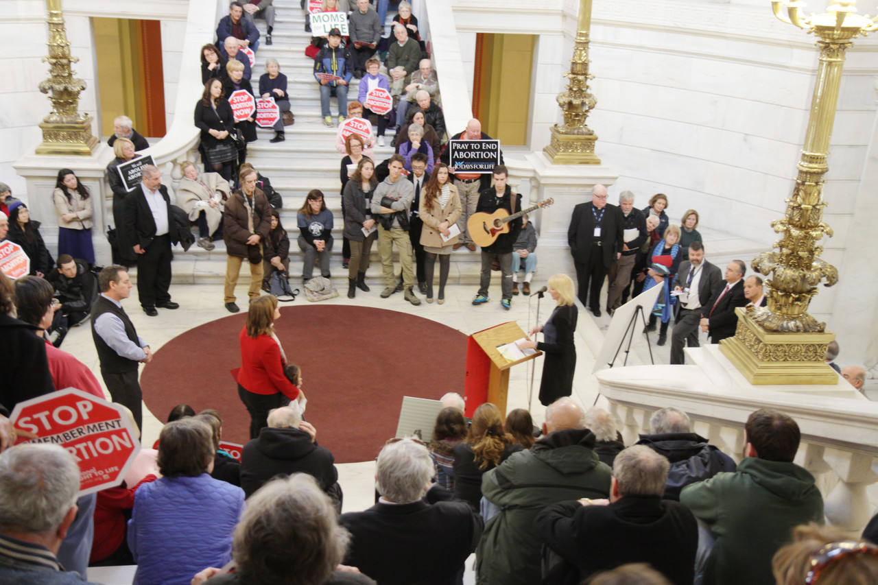 More than 150 individuals gathered at the State House last Wednesday to make their voices heard on behalf of the unborn at the annual statewide pro-life rally. Well-represented among the participants were young people who attended from local high schools and universities.
