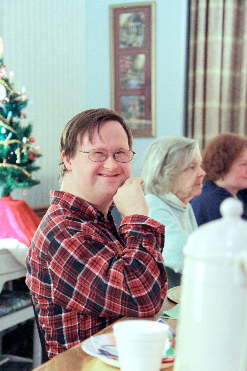 FAITH-FILLED FELLOWSHIP: Glen Bradshaw, a parishioner of Holy Apostles Church, Cranston, smiles at a SPRED Christmas party held at St. Benedict Church, Warwick, in December.