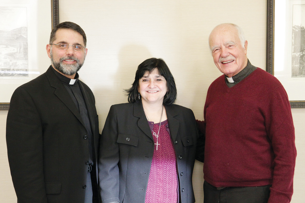 From left to right, Father Richard Narciso, recently appointed chaplain of the Apostolate for People with Disabilities, stands with Director Irma Rodriguez and his predecessor, Monsignor Gerard Sabourin.