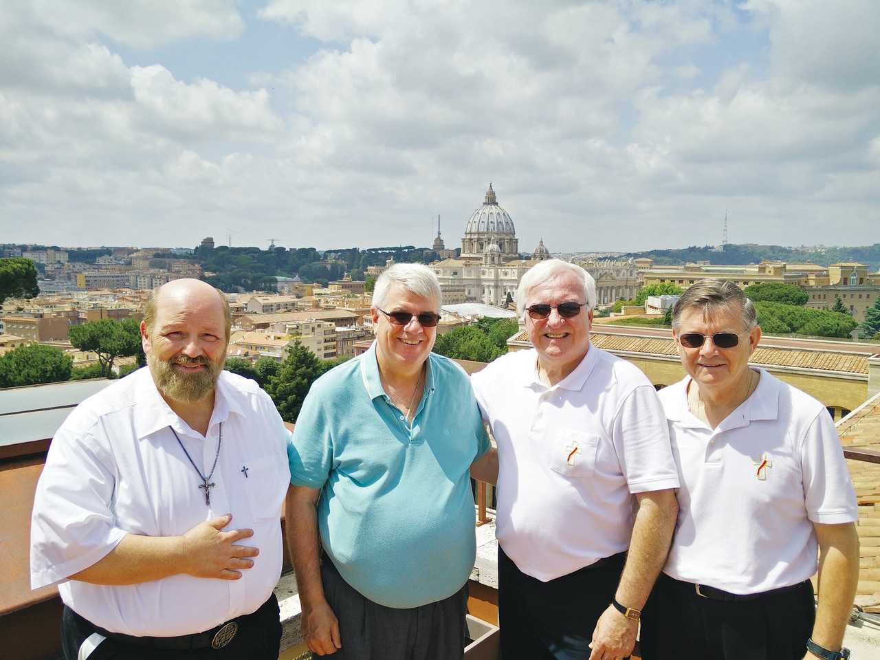 YEAR OF MERCY PILGRIMAGE: Deacon John Silvia, Deacon Bud Remillard, Deacon Robert Lafond and Deacon Cy Cote pose for a photo in front of the dome of St. Peter’s Basilica during their trip to the Vatican for the Jubilee of Deacons, May 27 through 29.
