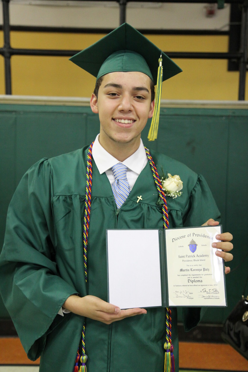 Martin Paiz proudly displays his diploma following the ceremony.