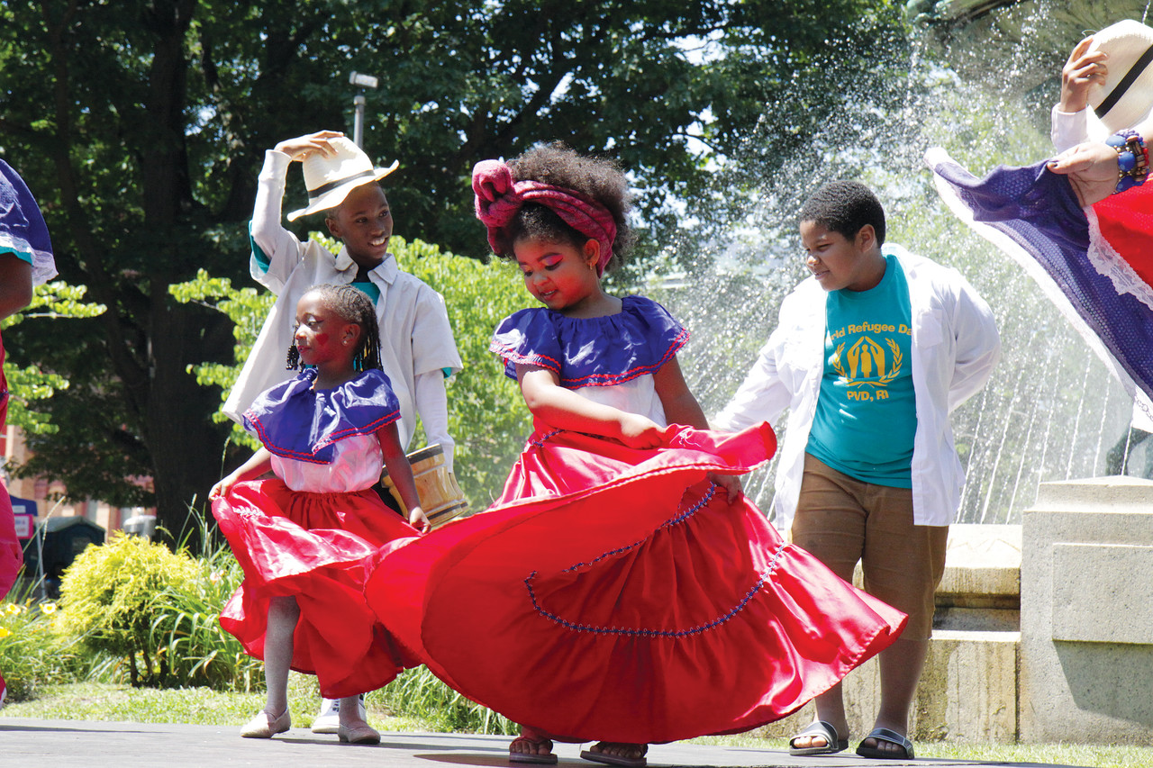 Samay Restrepo performs a traditional Colombian dance with her mother and other family members and friends.