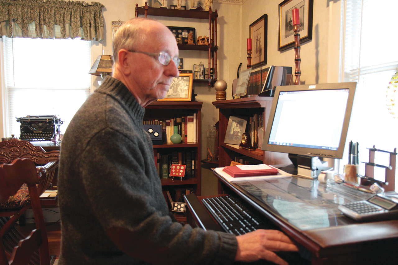 Still Serving the Church: Father John A. Kiley, a senior priest since 2011, works on his “Quiet Corner” column for Rhode Island Catholic. The Senior Priest Retirement Fund provides a lifeline for priests as they support themselves after providing decades of service.