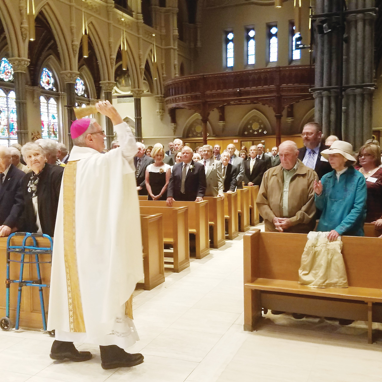Bishop Thomas J. Tobin blesses the sacred unions — in which couples marked 25 to 72 years of marriage.
