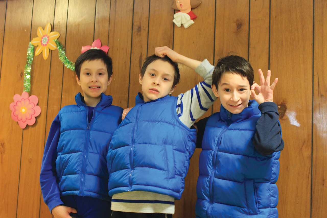 Triplets Dillon, Brandon and Michael Perugino, parishioners at Holy Apostles Parish in Cranston, were enrolled last year in the Autism and the Sacraments program at St. Peter Parish, Warwick, by their parents Michael and Tammy Perugino because of the expertise exhibited by the pastor Father Roger Gagne, Coordinator Margaret Andreozzi and the teaching staff in ministering to those with autism. “This program is unbelievable, it’s the best thing for kids,” said Tammy Perugino.