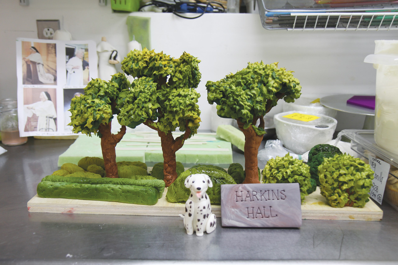 Friarboy the dalmatian is one of four fondant figures who adorned the Harkins Hall-replica cake, which also included a university gate and hand-piped frosting trees like the ones seen here.