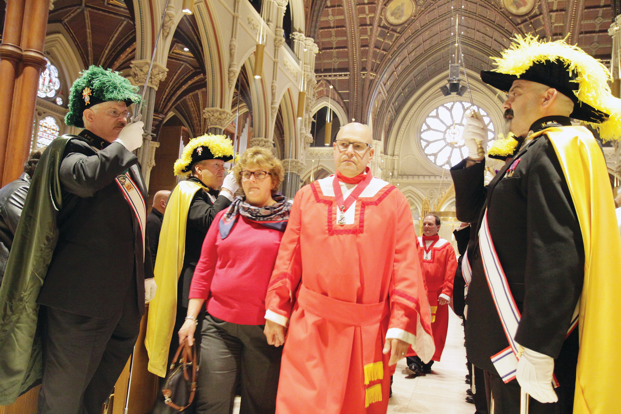 Fourth Degree Knights stand at attention as honored guests process to the back of the Cathedral following Mass Sunday to mark the closing of the Holy Door and the Year of Mercy.