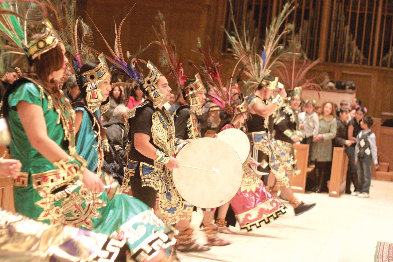 CULTURE OF DEVOTION: Aztec dancers honor La Virgen at the cathedral in 2010.