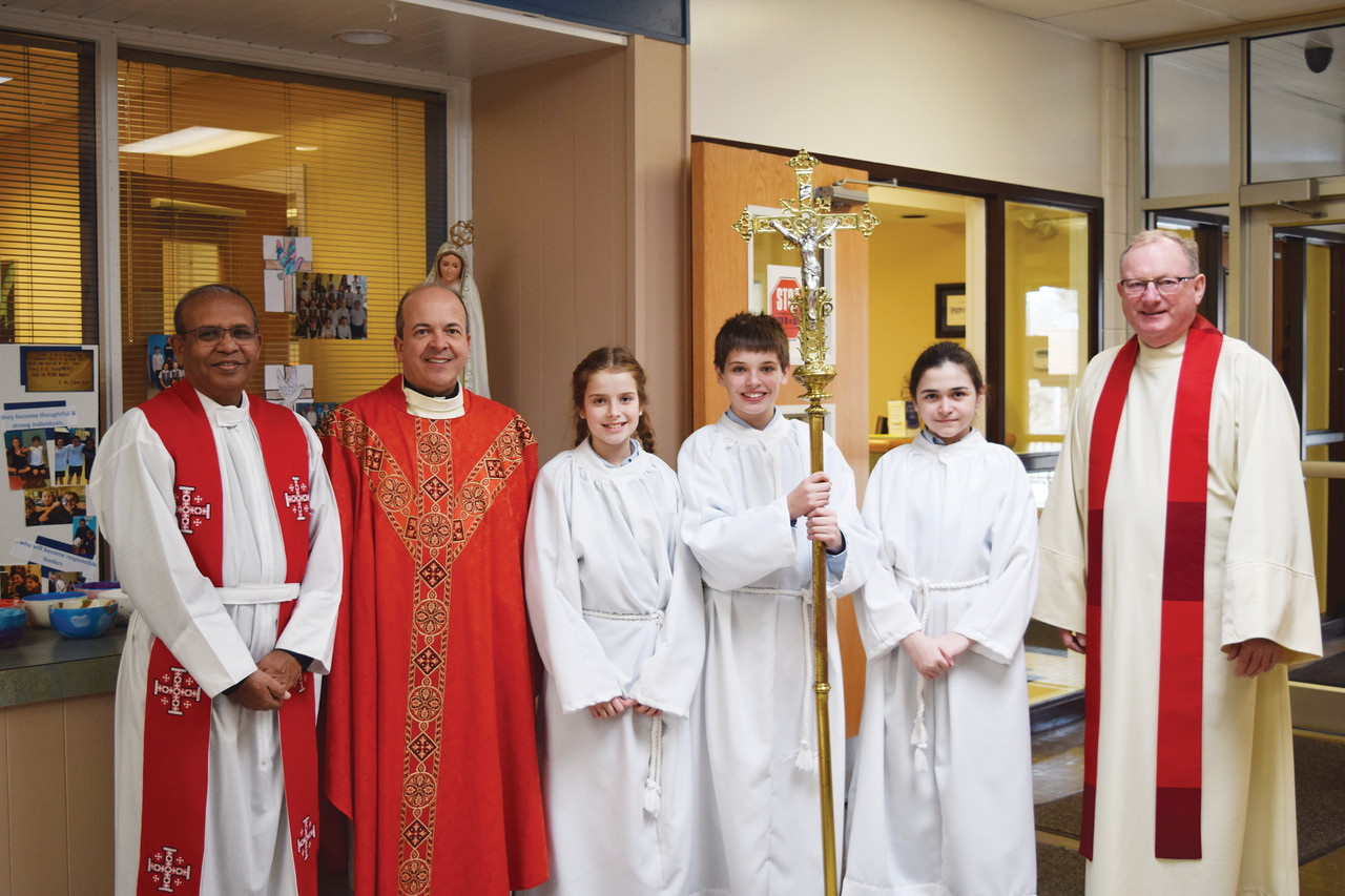 Celebrants and student altar servers of Friday’s school Mass pictured from left to right, Father Vijay Kiran, Father Marcel Taillon, Veronica Wathen, Matthew Cabrera, Mary Whaley and Father John Unsworth.