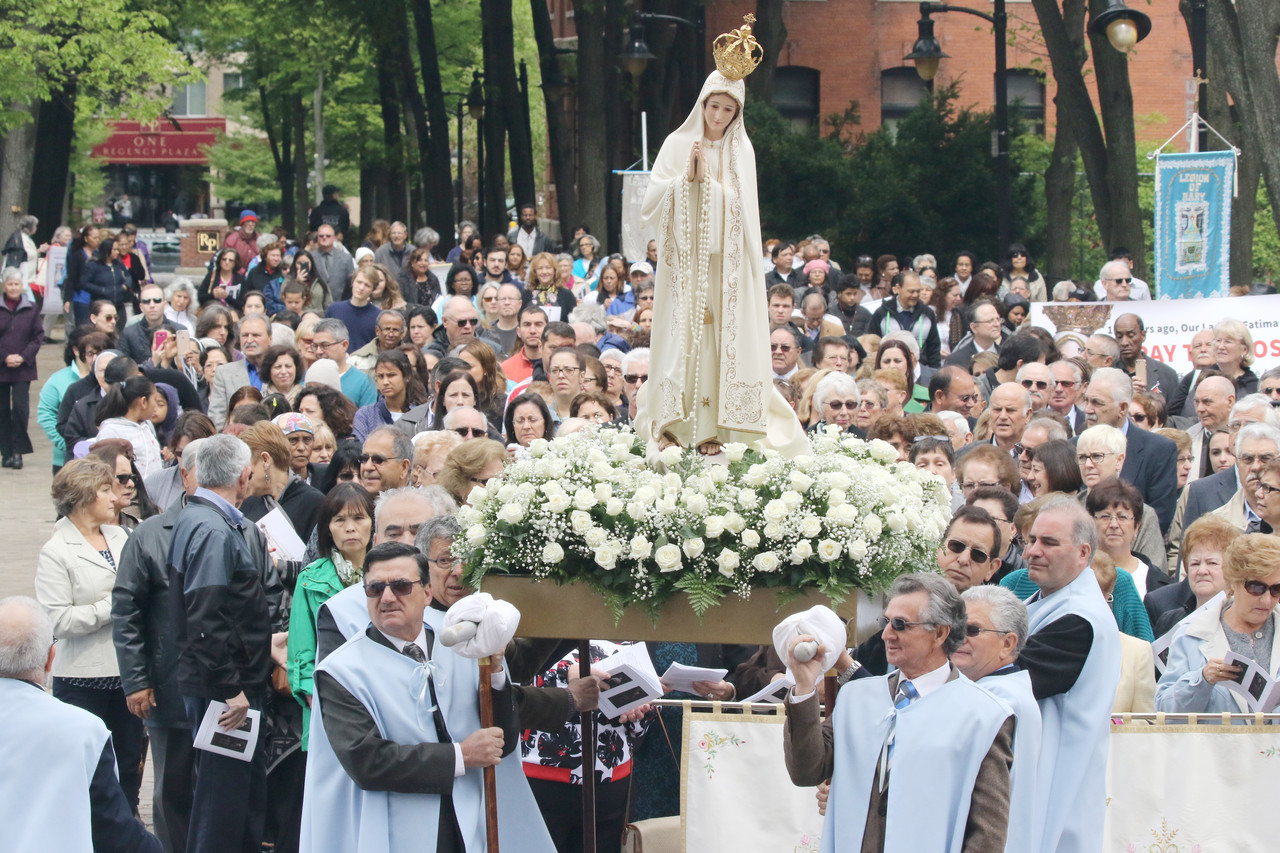 Heaven Sent: Celebrating the 100th anniversary of the Fatima apparitions, pilgrims hold a procession in Cathedral Square before Mass at the cathedral.