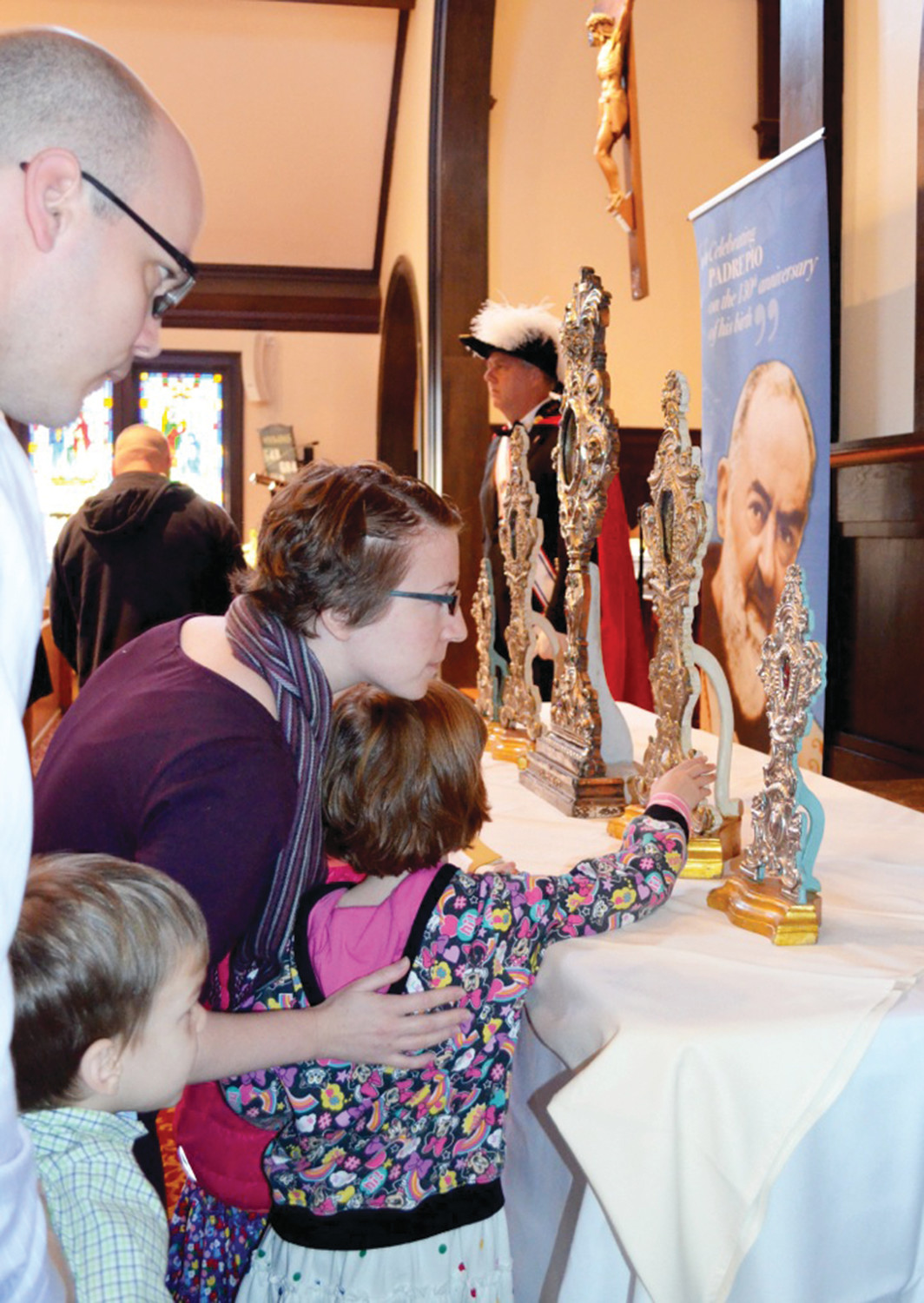 Families admire the relics on display.