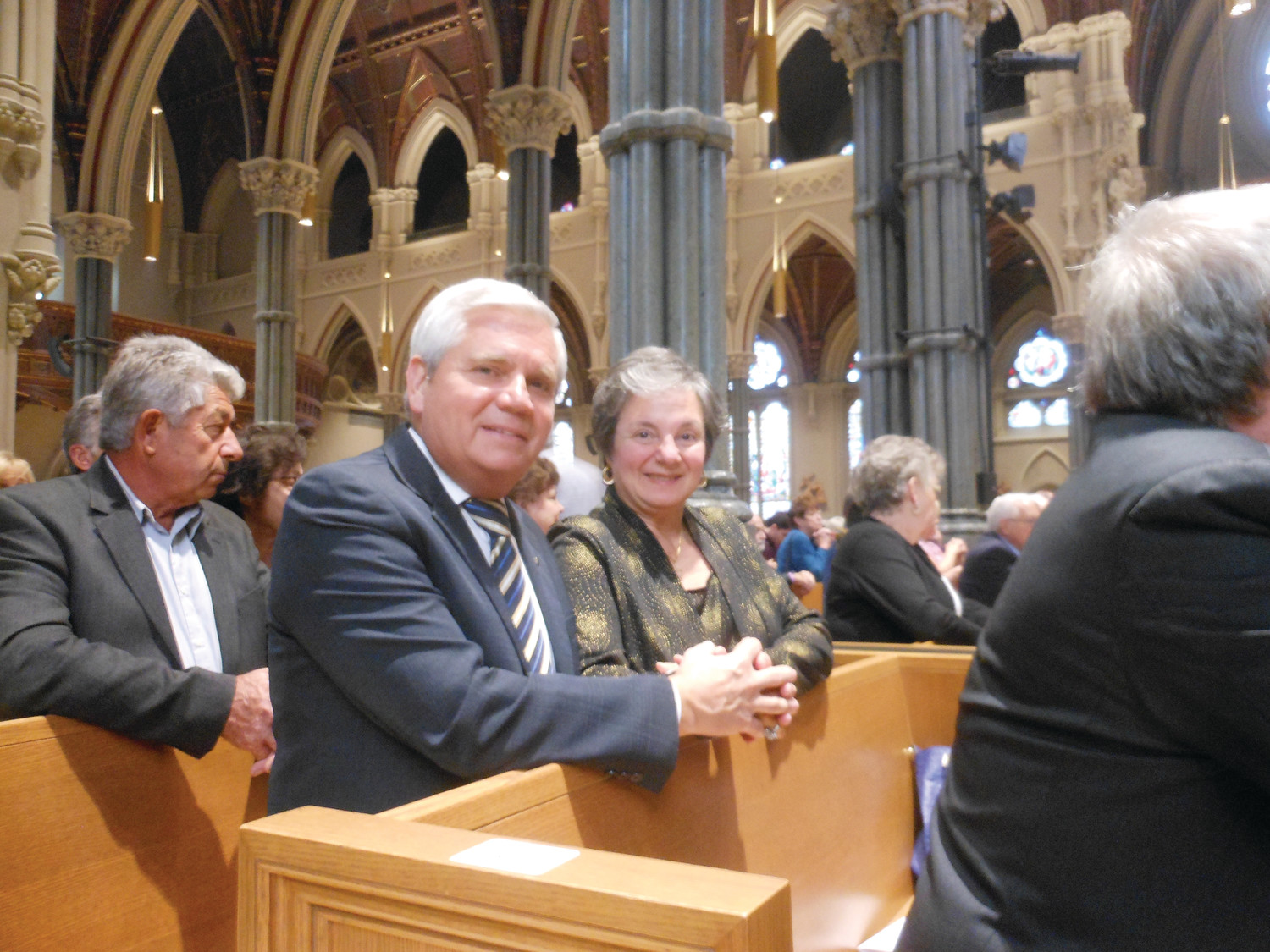 Richard and Susan Denningham of Immaculate Conception Church in Cranston hold hands during Mass.  The couple has been married for 40 years, though this is the first time they’ve attended the Anniversary Celebration. “We missed it on our 25th anniversary,” said Susan, “so we made sure we made it for our fortieth.” Richard expressed that participating in the ceremony was worth the wait: “it’s such a great chance to testify to your love in front of God.”