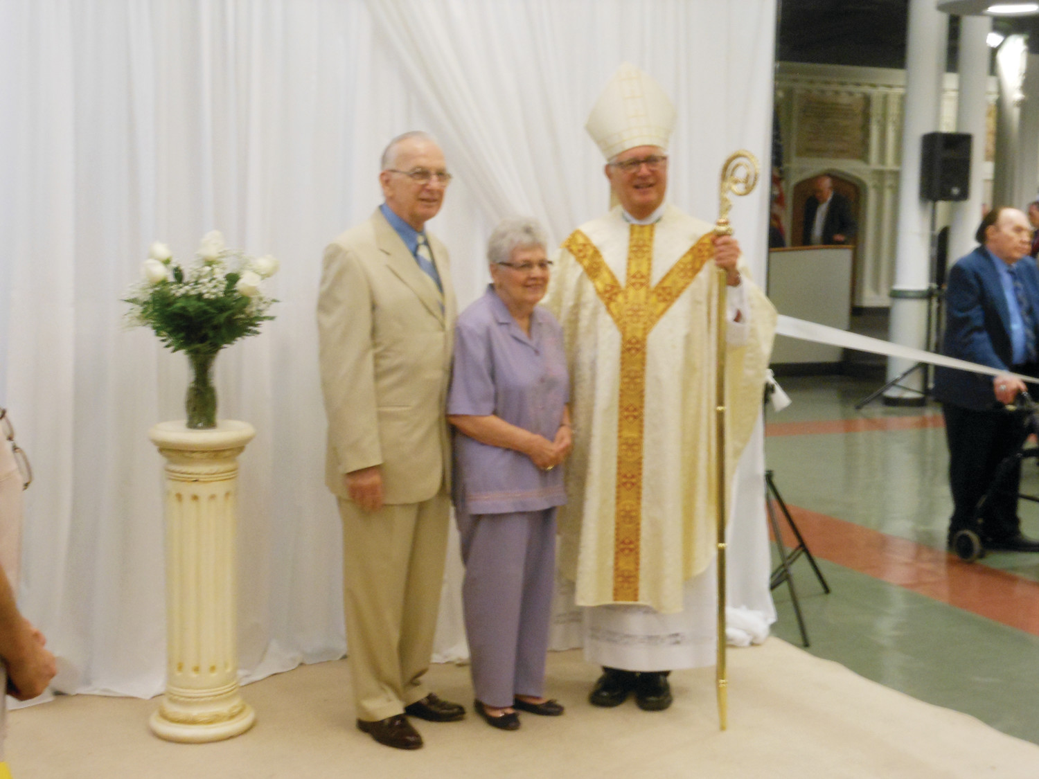 Normand and Lorraine Dalpe of Saint Theresa Parish in Harrisville pose for a photo with Bishop Tobin. The couple celebrated their diamond anniversary of 60 years.
