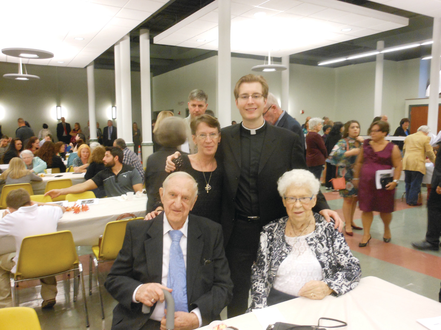 Among the longest married couples at Sunday’s event, Clarence and Mary Barrow (pictured with daughter Mary Barrow and grandson Father Joshua Barrow) have been together for 65 years.  The two planned to renew their vows in a Mass celebrated by their grandson in the days following the Mass. Asked what the secret to such a long and happy marriage was, Clarence replied laconically: “Just keep going.”
