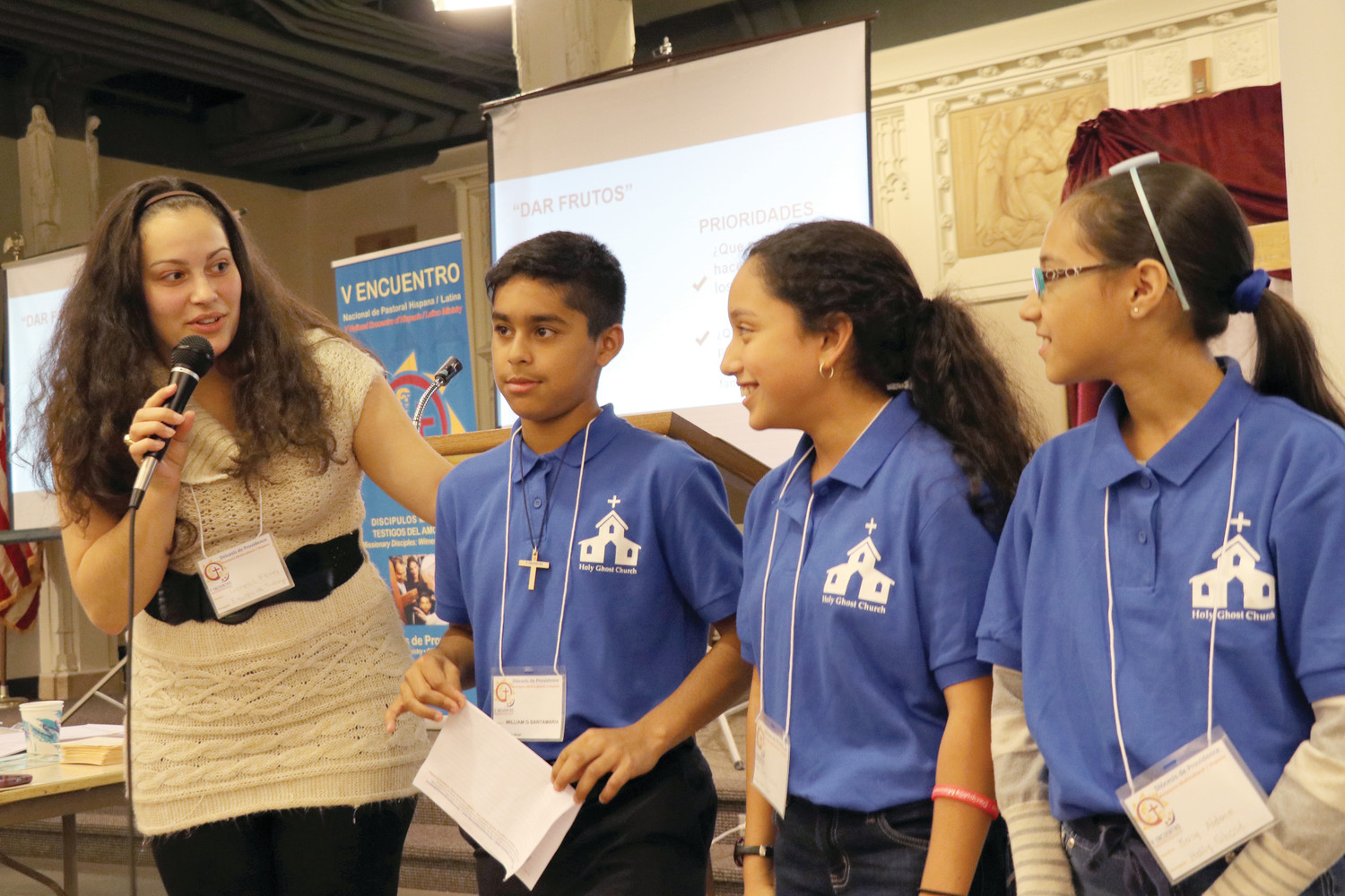 Genesis Flores, of the diocesan Office of Immigration, speaks with some young people from Holy Ghost Church about their hopes and dreams during the Diocesan Encuentro. With Flores from left are: William Santamaria, Juana Carrera and Keisy Aldana.