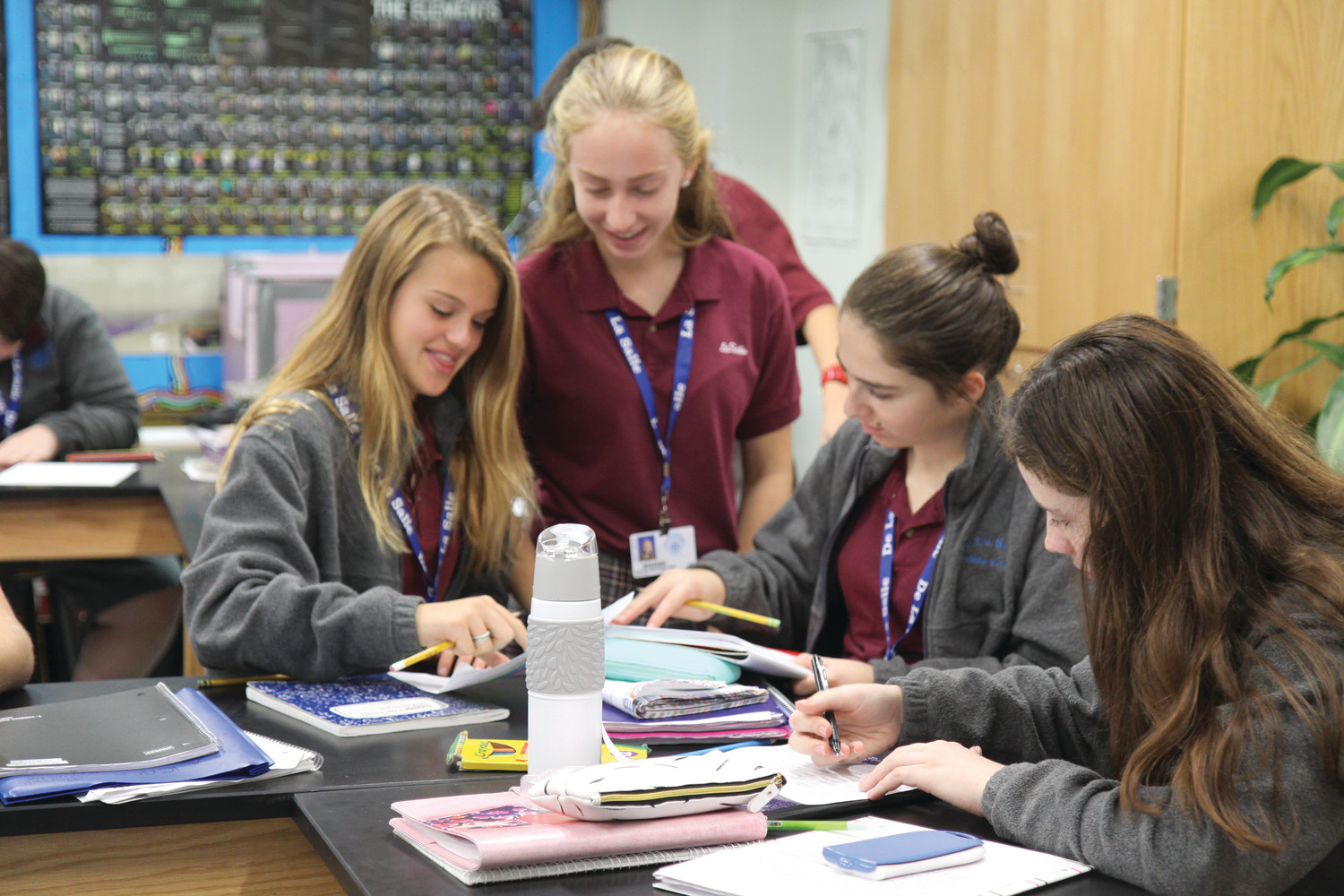 Students at La Salle Academy work together on classwork. Creating work spaces that support group-centered, technology-integrated learning is one of the priorities of many schools’ current renovation projects.