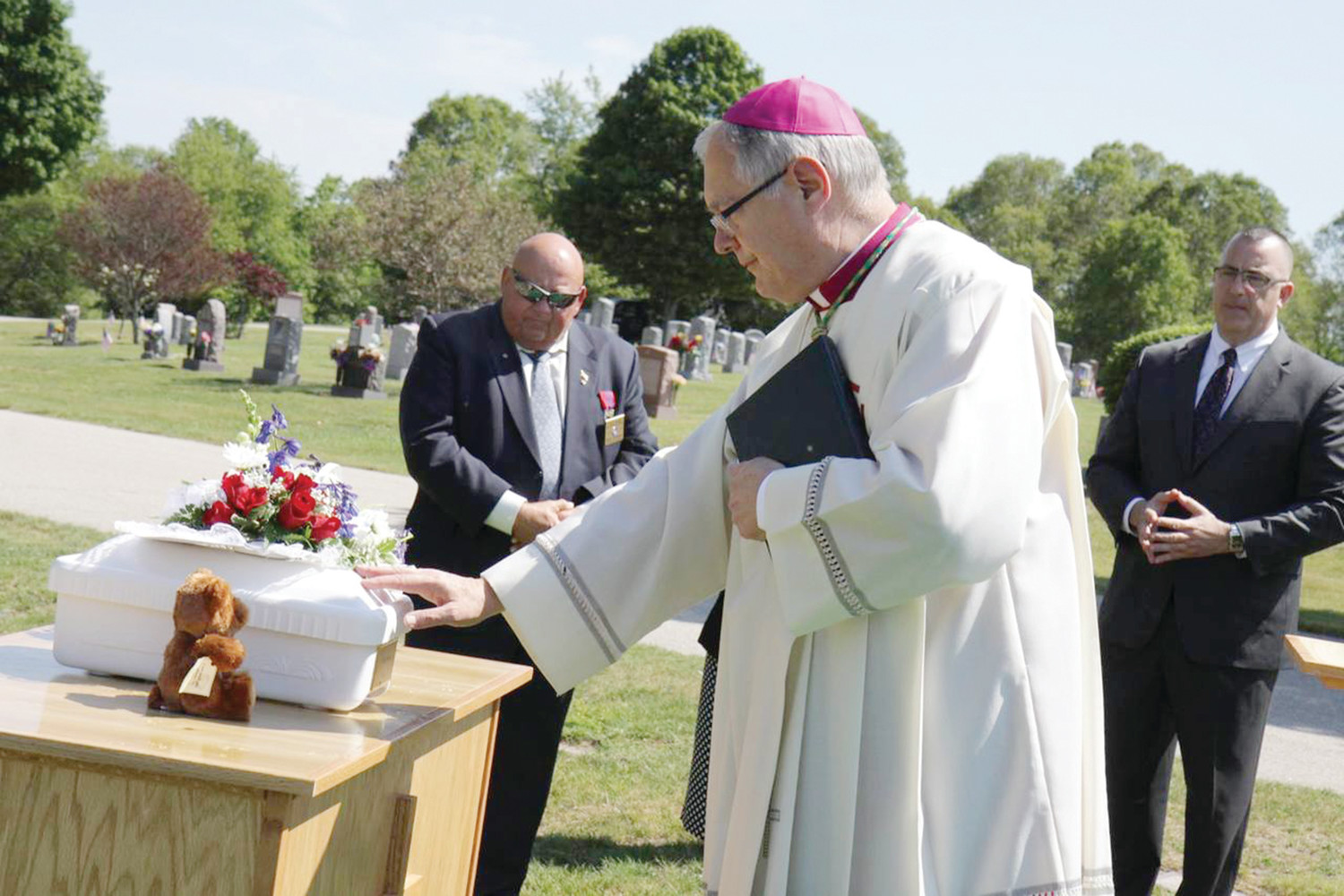 In June 2015 in a simple, but dignified ceremony in a section of Gate of Heaven Cemetery set aside for the repose of babies, Bishop Tobin presided over a Christian burial service for the unborn child he named “Francis,” fulfilling a commitment he made to officials five months before after a fetus was found floating amid the sewage at a nearby wastewater treatment facility. The tiny white casket, with “Baby Francis 2015” inscribed on a gold plaque affixed to one end, and flanked by flowers and a small teddy bear, rested upon a portable pine altar as the burial service was conducted.