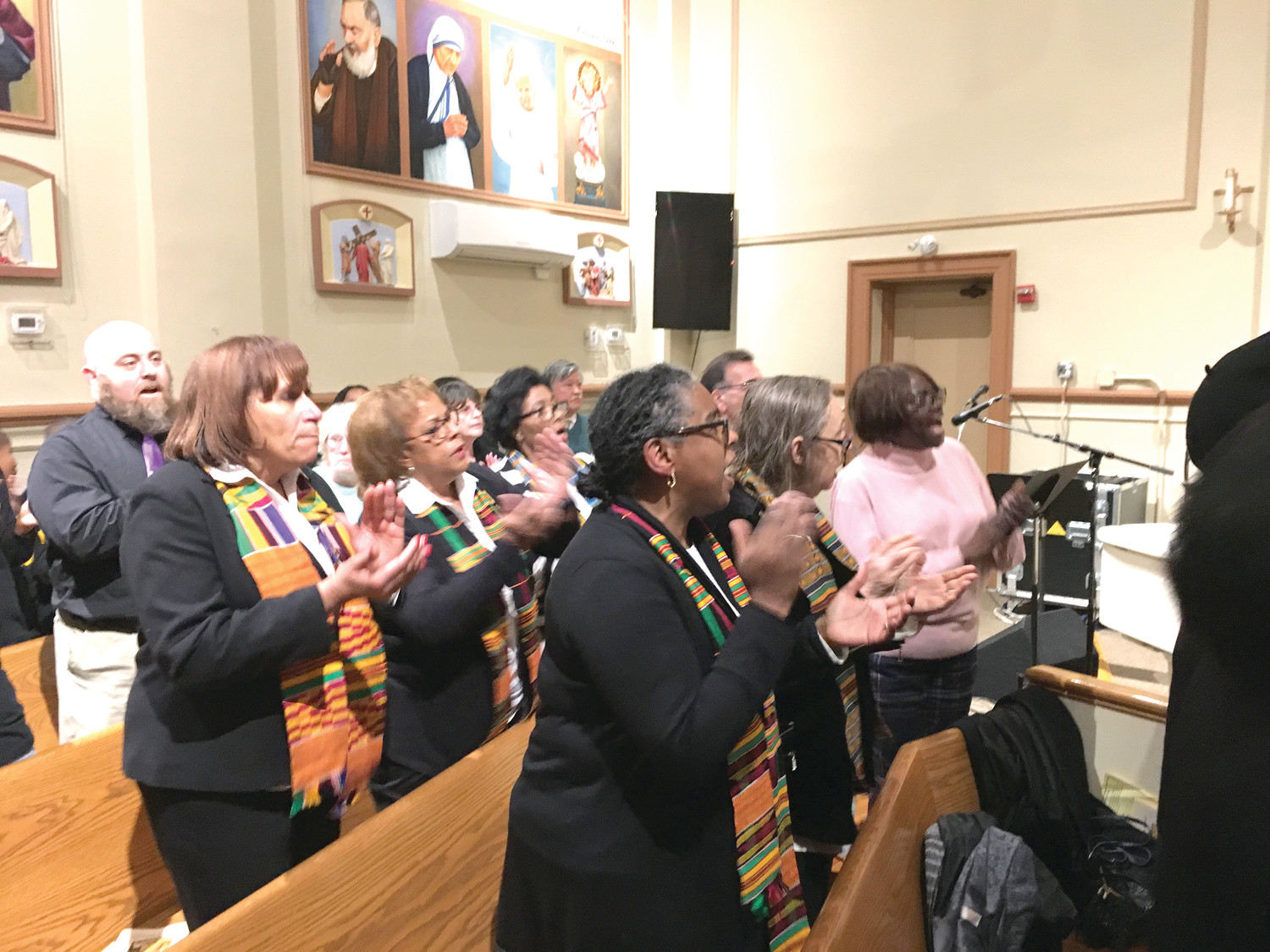 The Holy Name of Jesus Gospel Choir performs a song during the Martin Luther King celebration.