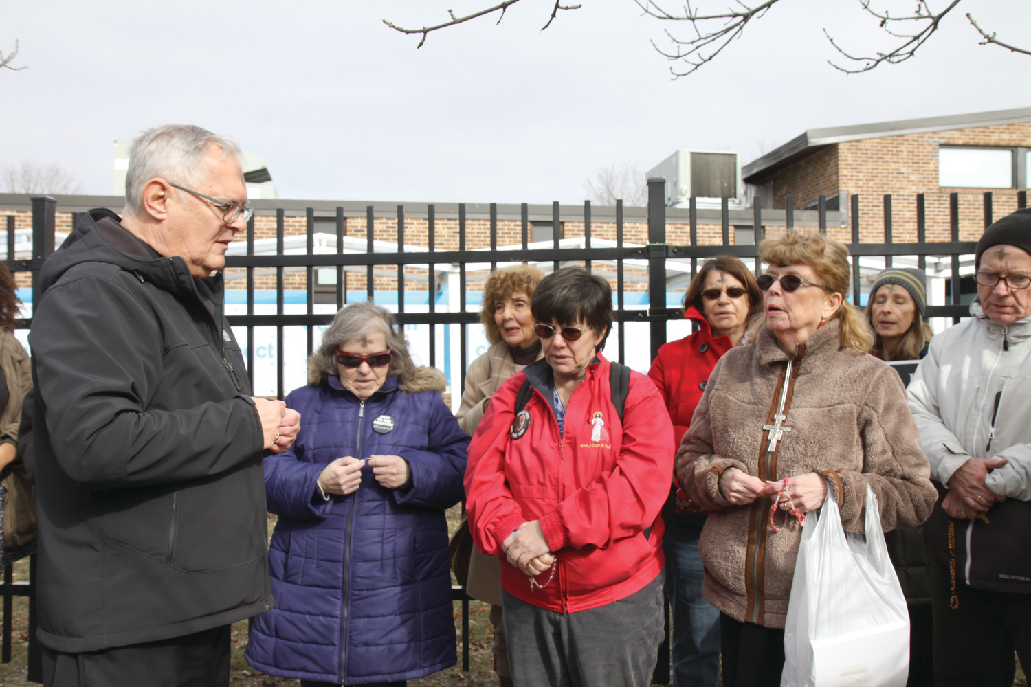 Bishop Thomas J. Tobin prayed the rosary with other pro-life advocates outside the Providence Planned Parenthood clinic following a procession from the Cathedral of Saints Peter and Paul.
