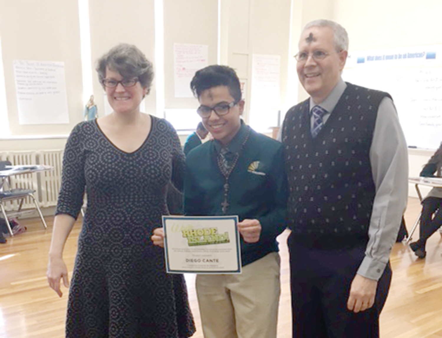 Pictured, Diego Cante with his teacher Brett Summers and Principal Bruce Daigle.