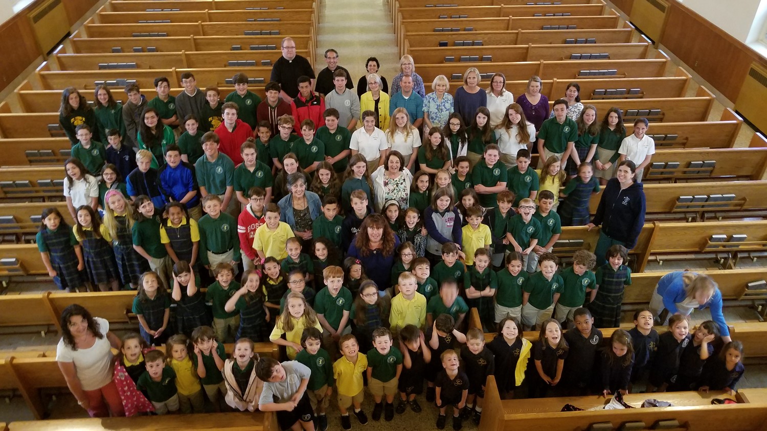 The student body of St. Pius X Regional Academy gathers for a group photo during the School Thanksgiving Mass on June 10. After 55 years of service, the Westerly school closed this year.