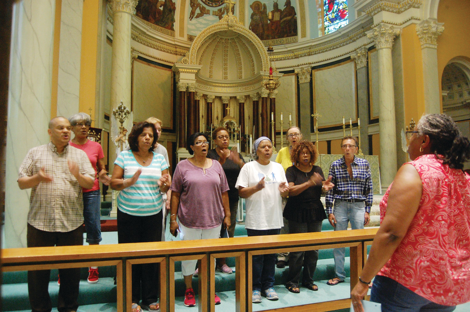 Members of the Holy Name of Jesus Gospel Choir, along with some of their brethren from the Providence parish’s two other choirs — the African Community Choir and the St. Ambrose Schola Cantorum — rehearse for their concert on Sunday, Sept. 9 at Holy Name of Jesus Church.