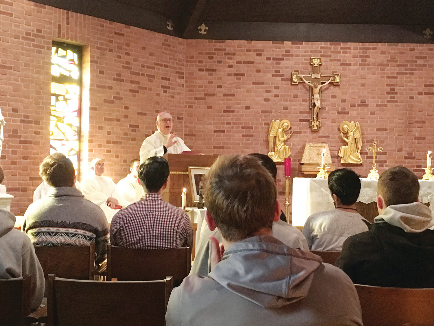 Bishop Thomas J. Tobin celebrates Mass during the annual College Retreat at Our Lady of Providence Seminary on Saturday, Jan. 12. Twenty-five men traveled to the Providence Seminary to take part in a discernment retreat.
