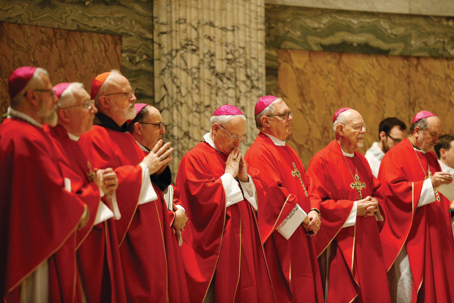 Pictured at center, Auxiliary Bishop Robert C. Evans,  Bishop Thomas J. Tobin, and retired Auxiliary Bishop Peter A. Rosazza of Hartford, Conn., concelebrate Mass with other U.S. bishops from the New England states at the Basilica of St. Paul Outside the Walls in Rome Nov. 5.