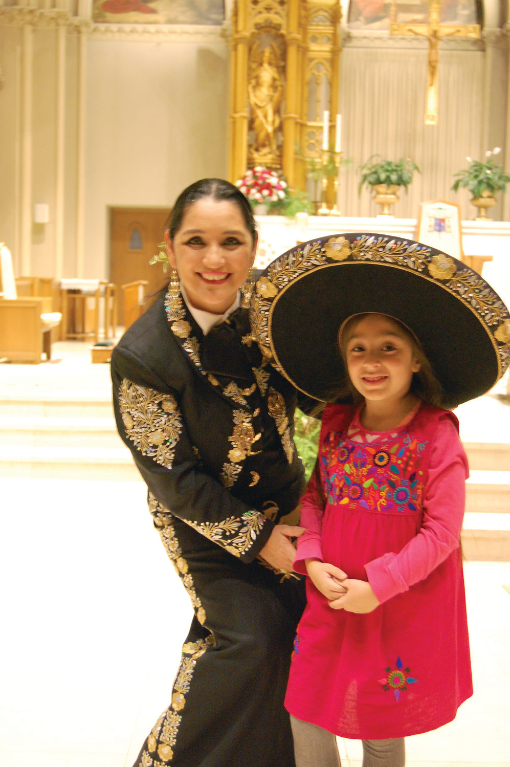Singer Veronica Robles with Iracema Monterroso-Perin, 5, of Providence.