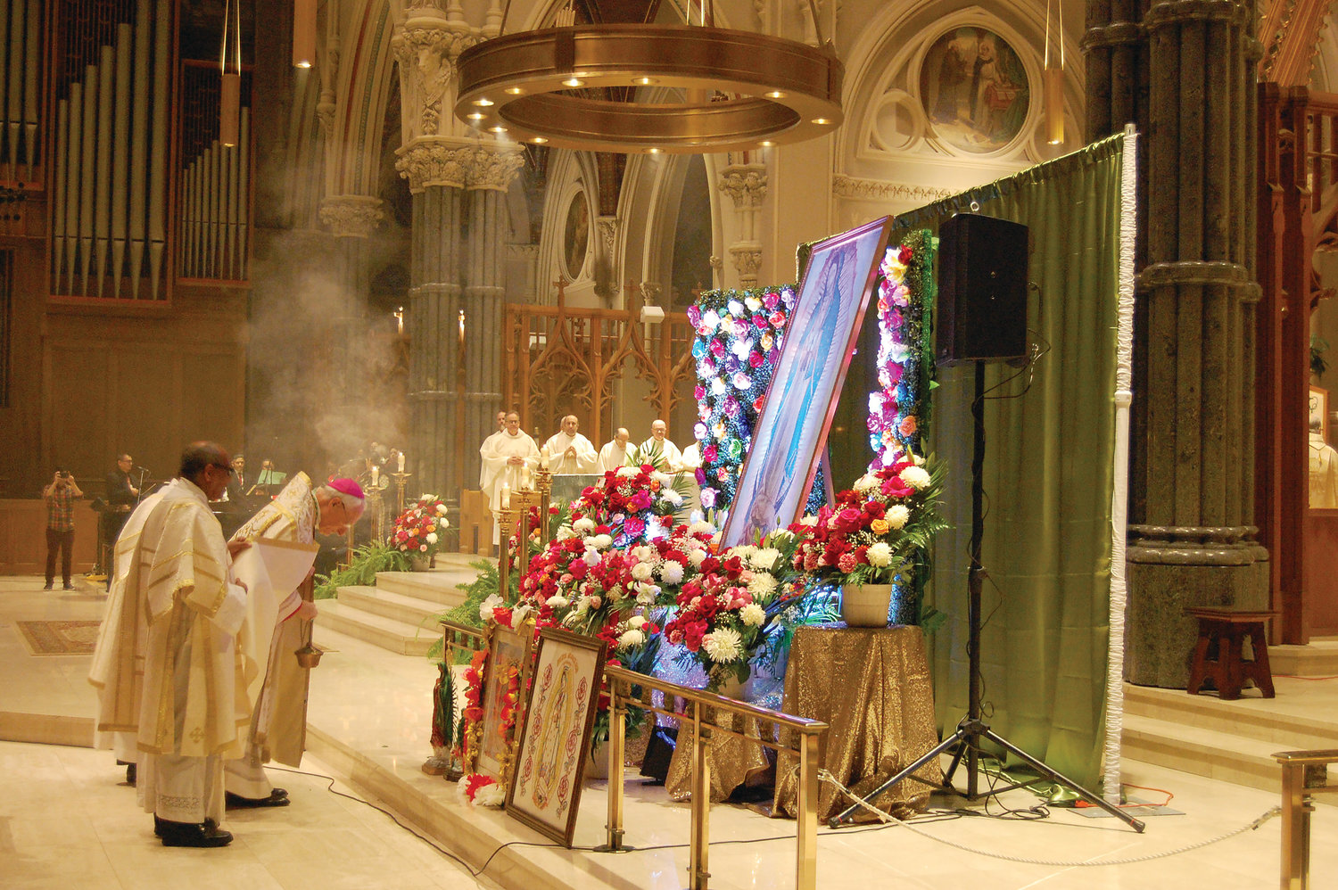 Bishop Robert C. Evans venerates an image of Our Lady of Guadalupe during Mass celebrated on Dec. 12.