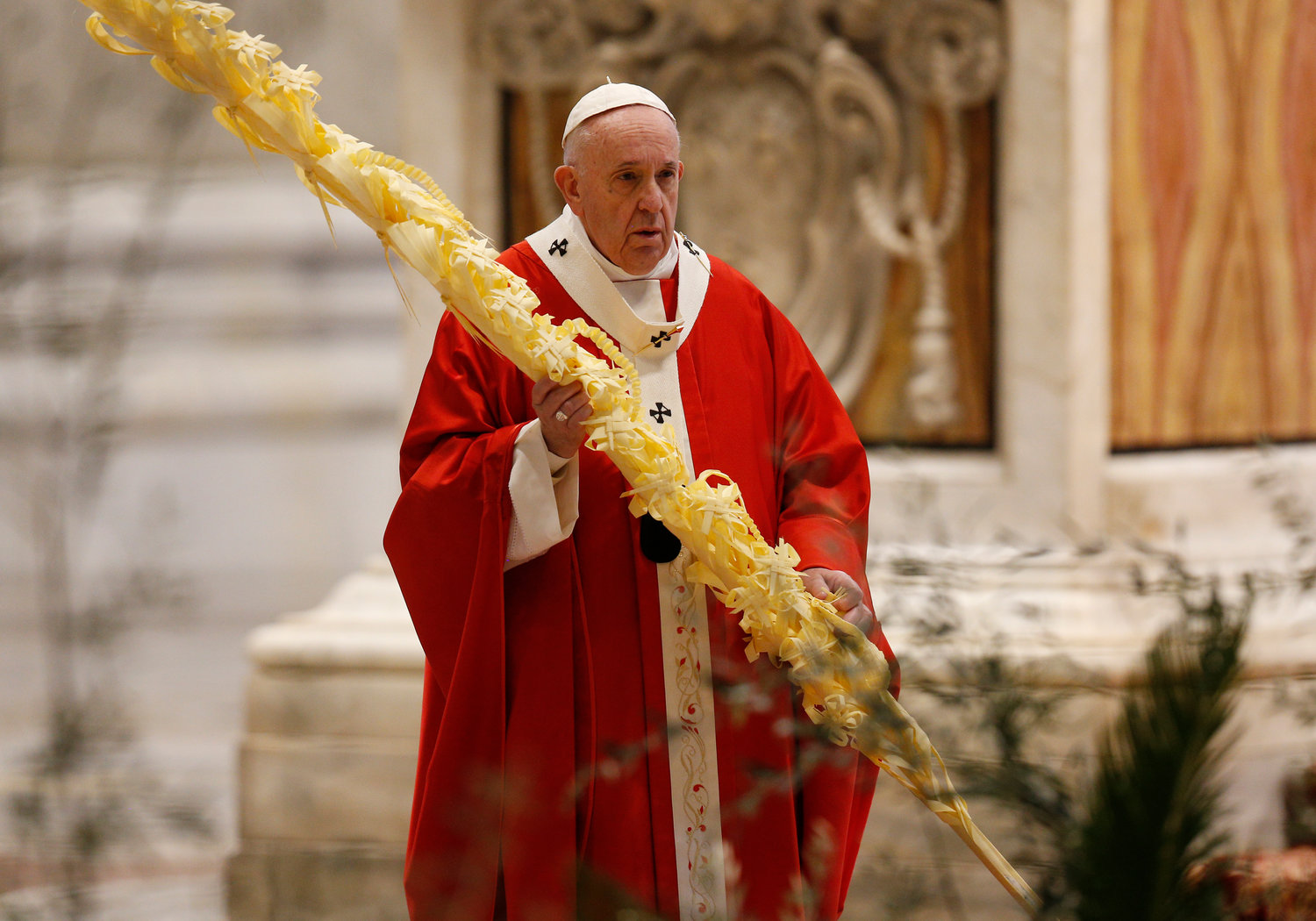 Pope Francis holds palm fronds celebrates Palm Sunday Mass in St. Peter's Basilica at the Vatican April 5, 2020. The Mass was celebrated without the presence of the public as Italy battles the coronavirus.