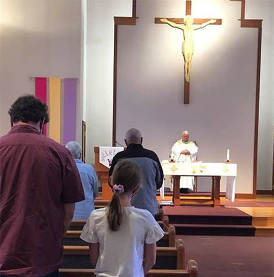 Parishioners at St. Maximilian Kolbe Church in Scarborough, Maine, return to public Mass for the first time since mid-March.