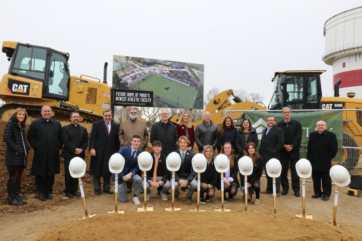 Bishop Thomas J. Tobin, sixth from left, gathers with diocesan and Prout School officials, including Principal David Estes, fourth from left, along with committee members and students who have worked hard to develop a first-rate, multi-use athletic field on the school’s Wakefield campus.