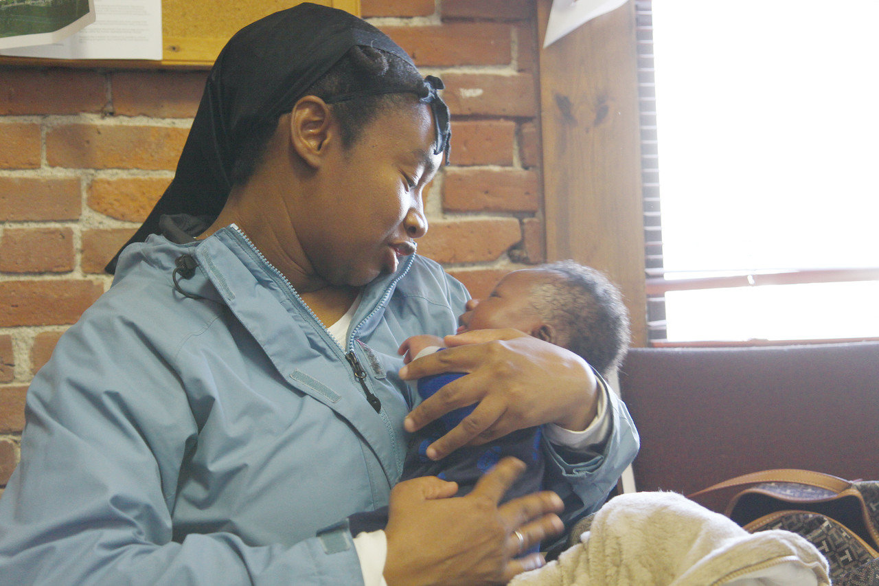In this 2016 photo, Sandra Seals, pictured with her infant son, Musa, was a beneficiary of the Saint Gabriel’s Call Ministry. To strengthen this already faithful commitment to mothers and families in Rhode Island, Bishop Tobin recently announced a pledge to double the assistance the diocese provides to pregnant and new mothers, as well as their children, through this ministry that has an incredible impact on countless lives. The commitment increases annual funding for assistance to mothers and their children to $50,000. The increased resources will allow the ministry to provide financial, material, social-emotional and other wide-ranging support to mothers and their children including cribs, car seats, furniture, baby clothes and linens, diapers, formula, toys, household goods, toiletries and gift cards.