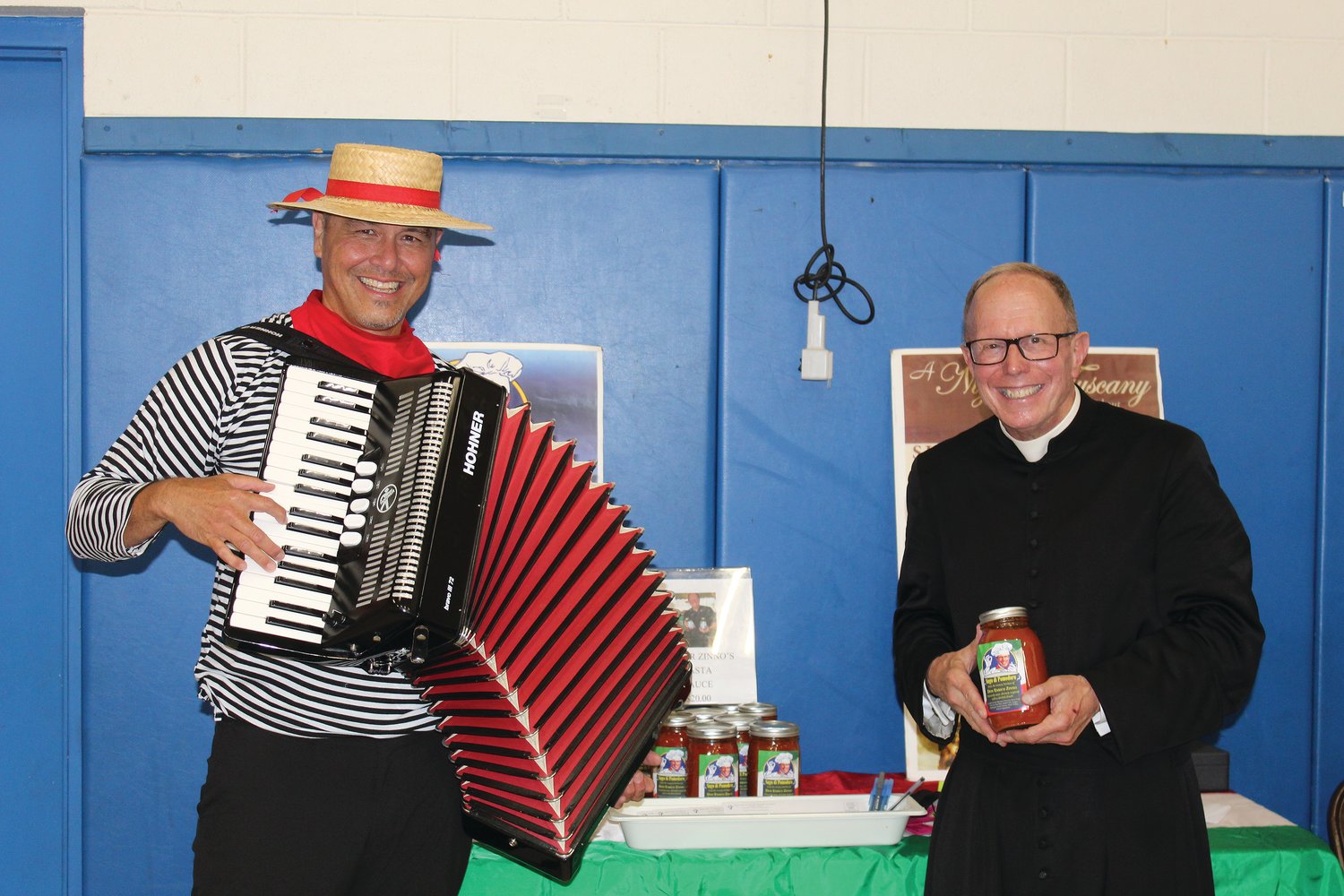 Father Zinno poses with a jar of his signature marinara sauce at the Our Lady of Mount Carmel Feast on July 17, three days before his surgery. The annual celebration, founded in 1899, is the oldest Italian festival in the diocese.