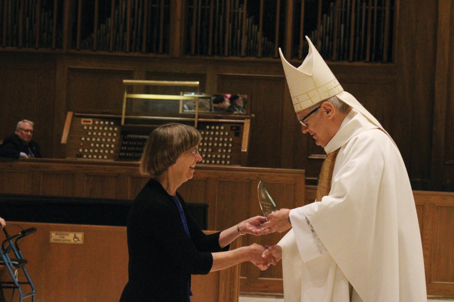 Bishop Tobin presents a Human Life Guild Award to Christine Eiva.