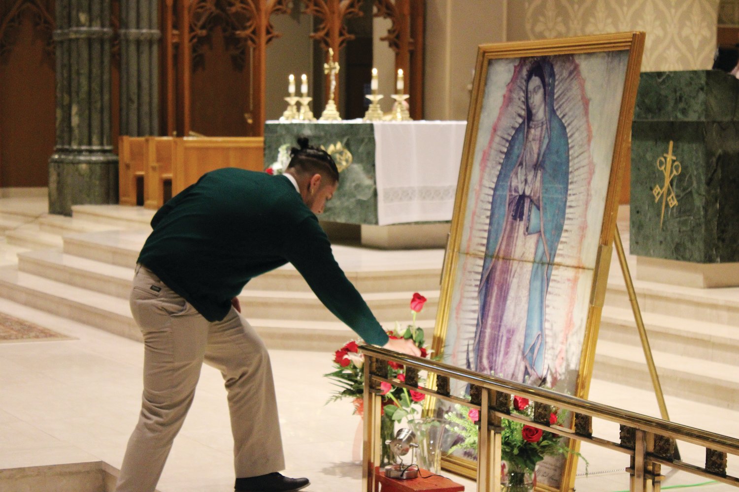 Participants of the Holy Mass for Life, in Thanksgiving for the gift of life, held Saturday, Jan. 21, in the Cathedral of Saints Peter and Paul, honor Our Lady of Guadalupe with flowers.