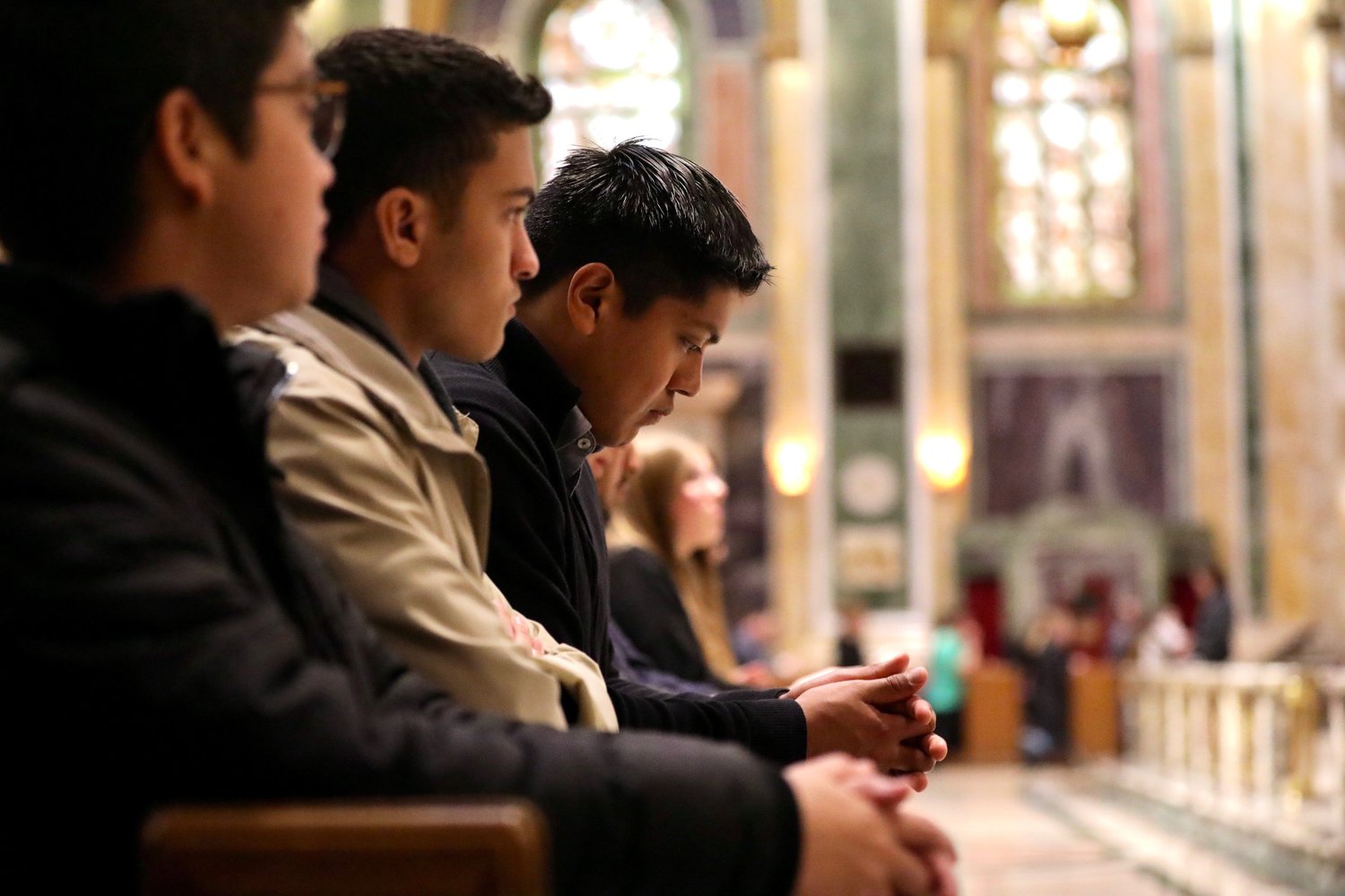 Young men pray during the Youth Mass of Celebration and Thanksgiving on Jan. 20, 2023 at the Cathedral of St. Matthew the Apostle in Washington.