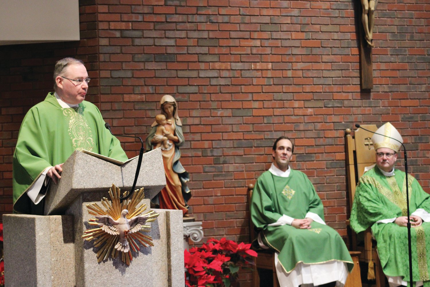 St. Philip Pastor Father Michael McMahon addresses parishioners at the end of the Mass.