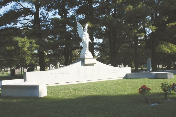 Situated on more than 191 acres, St. Ann Cemetery in Cranston is home to a grand memorial The names of the 100 people who perished in the 2003 fire at the West Warwick nightclub are inscribed on the monument.