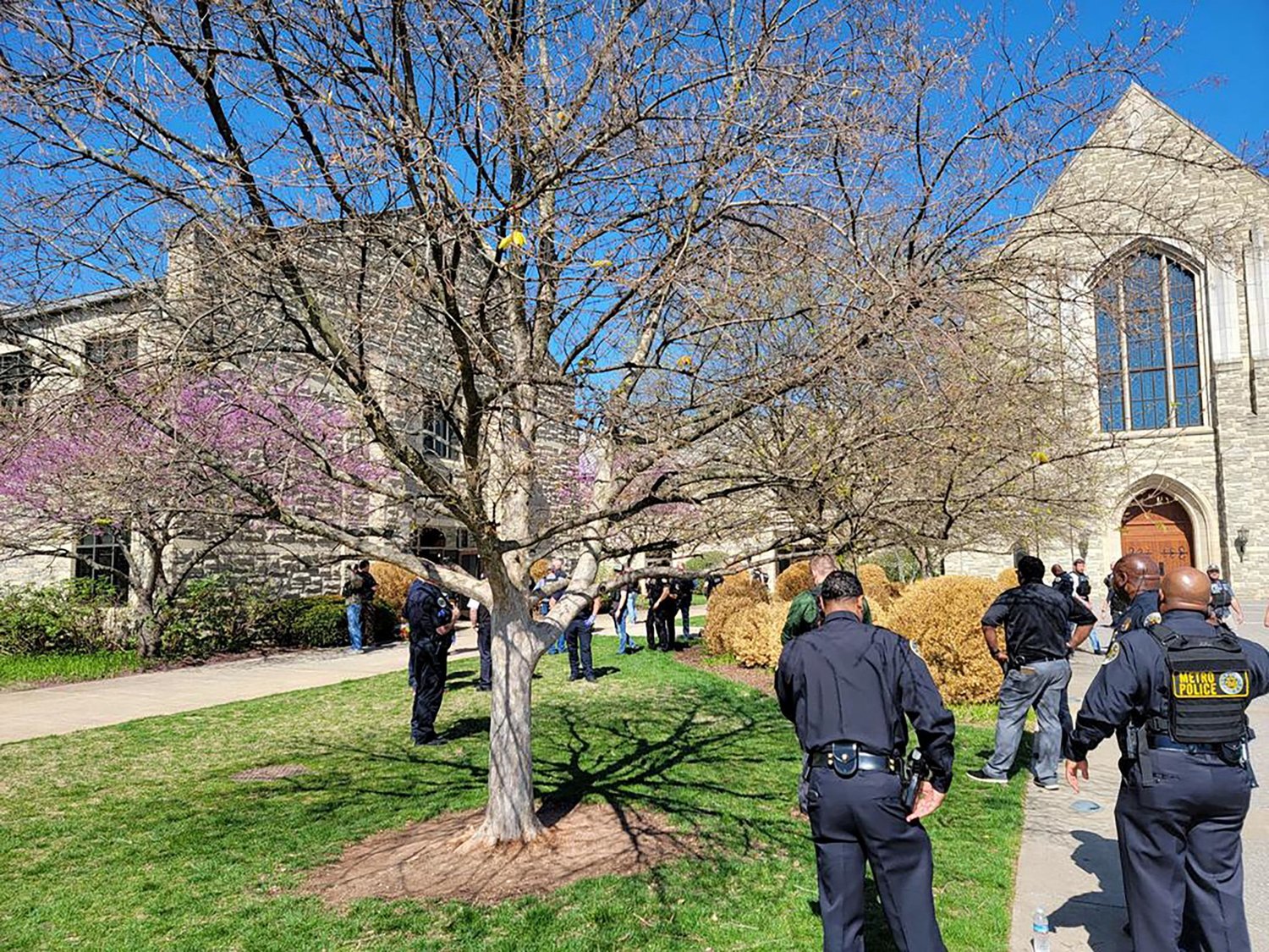 Police officers arrive at the Covenant School on the grounds of Covenant Presbyterian Church, after reports of a shooting in Nashville, Tenn., March 27, 2023. At least six staff members were killed, including three children, police reported.