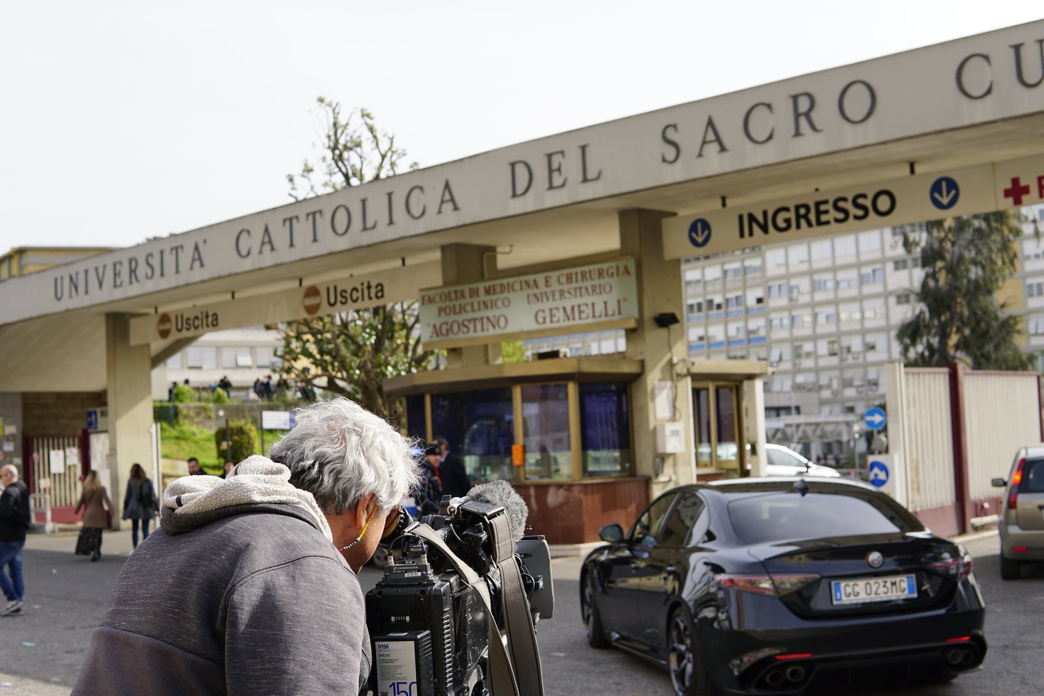 Members of the media report outside of Pope Francis' room in Rome's Gemelli hospital March 30, 2023. The pope was admitted to the hospital March 29 due to a breathing difficulty and was diagnosed with a "respiratory infection," according to the Vatican.