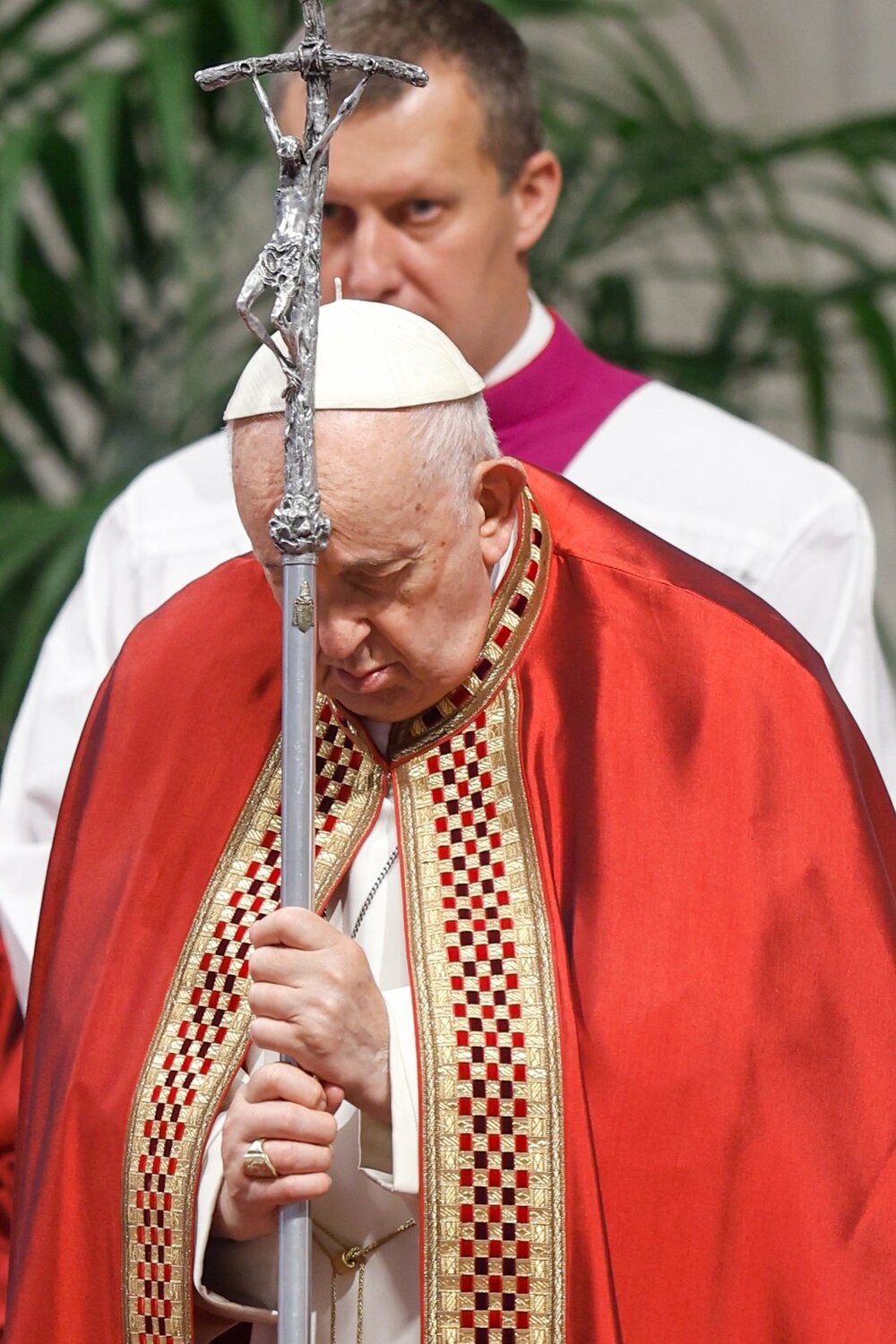 Pope Francis holds his crosier as the Gospel is read during his Pentecost Mass in St. Peter's Basilica at the Vatican May 28, 2023.