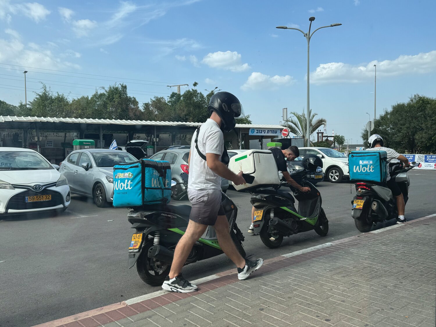 Despite daily rocket attacks, food deliveries continue, as life goes on in Ashdod, Israel, a commercial port city about 15 miles north of the Gaza Strip.