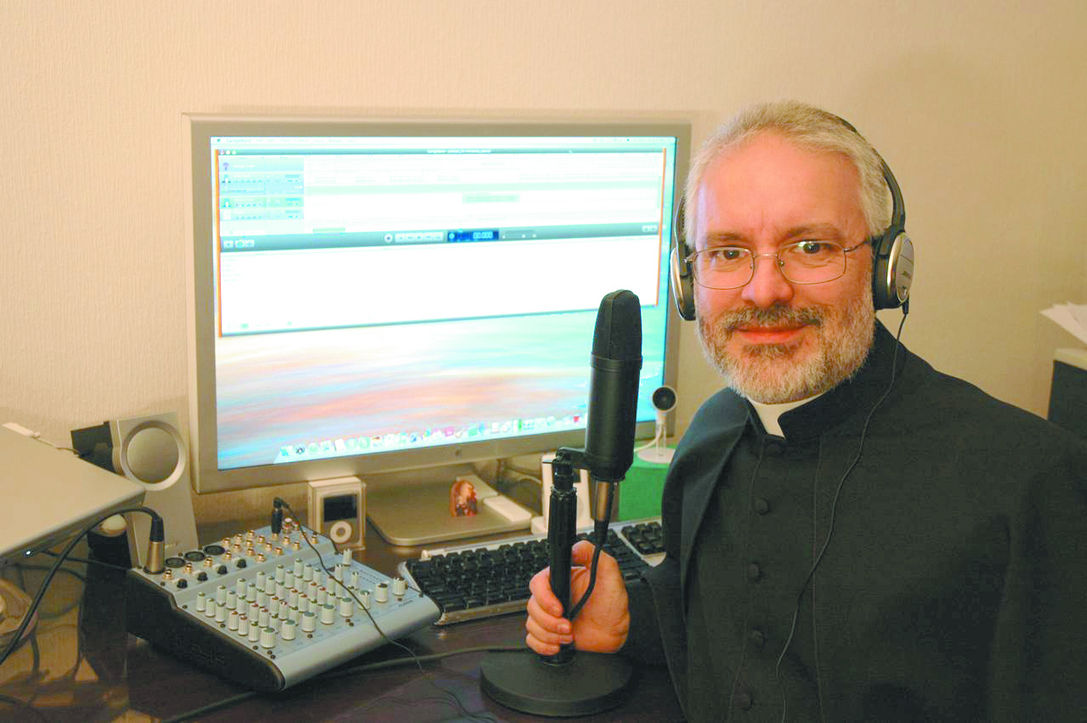 NOW HEAR THIS: Father Jay Finelli, pastor of Holy Ghost Church in Tiverton, isn’t intimidated at all by technology. In 
fact, he’s using it to bring the Good News to people around the world – who are now as close as his Podcast.